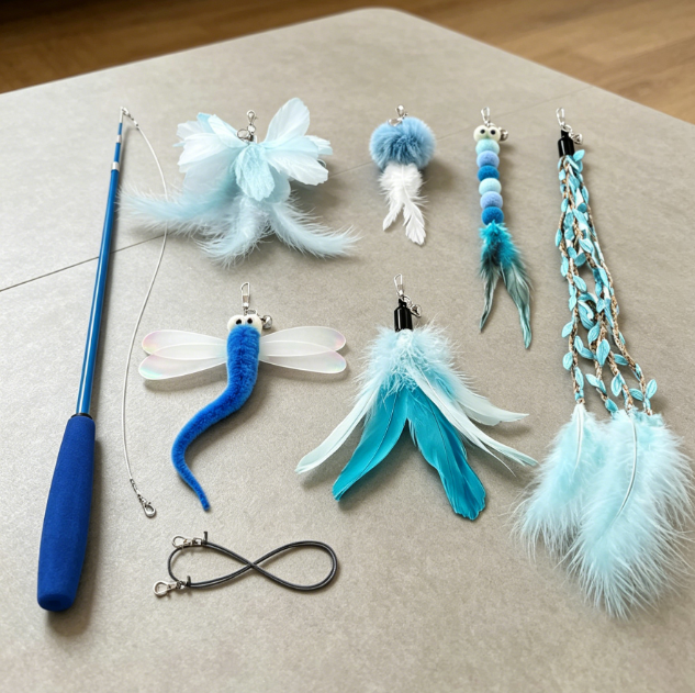 Retractable teaser wand with feather and dragonfly tassel